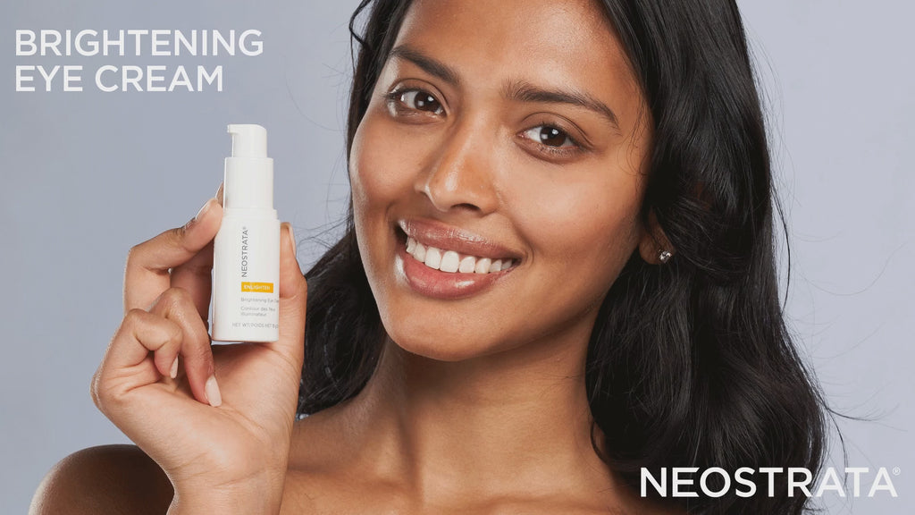 Gamme Neostrata Enlighten avec contour des yeux, sérum en pipette et deux tubes blancs sur un fond orange. - novaprapharmacie